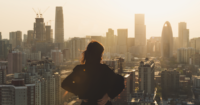 A woman looking out at the city landscape