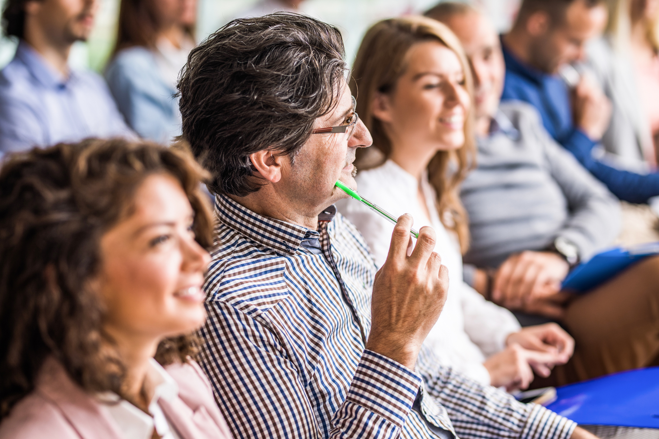 Thoughtful Businessman On A Seminar With His Colleagues.